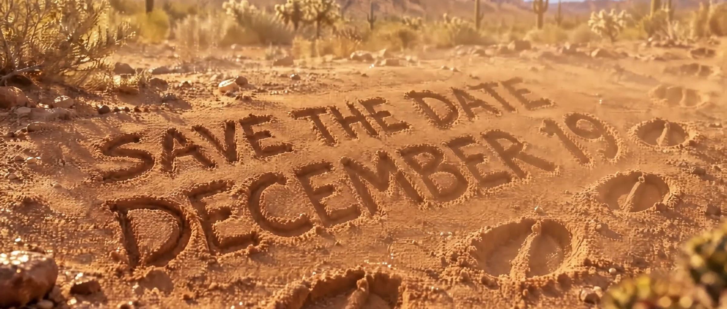 “Save the date · December 19” written in the desert sand, AI-generated